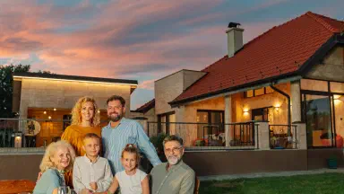 Family enjoying dinner in the backyard.