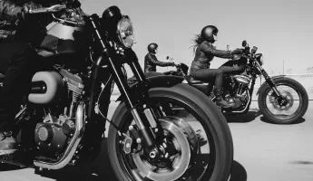 Three Harley Davidson motorcycles on the highway