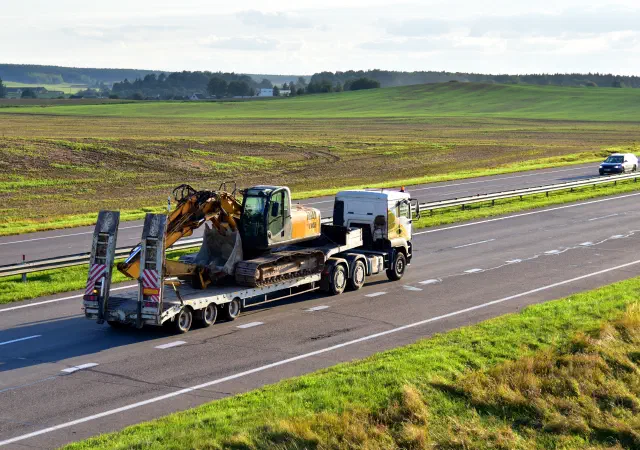 Excavator on flatbed trailer
