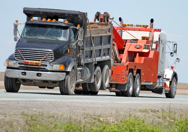 Wheel loader on flatbed trailer