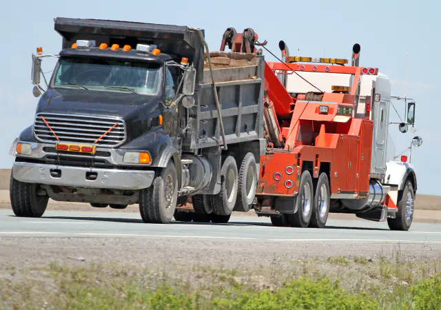 Wheel loader on flatbed trailer