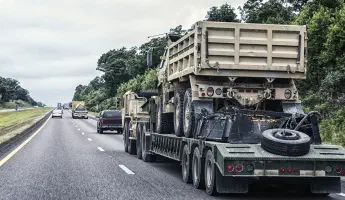 Military truck on a hauler