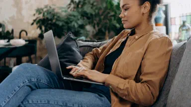 “User comparing auto transport quotes on bidding website”